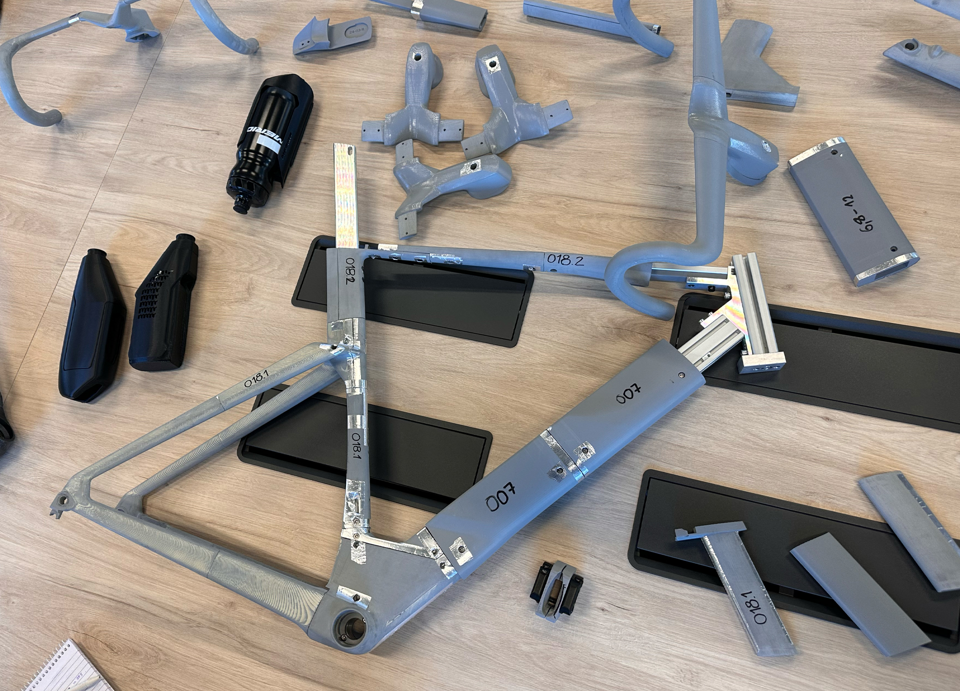 Fifth-generation Merida Reacto modular parts on a table