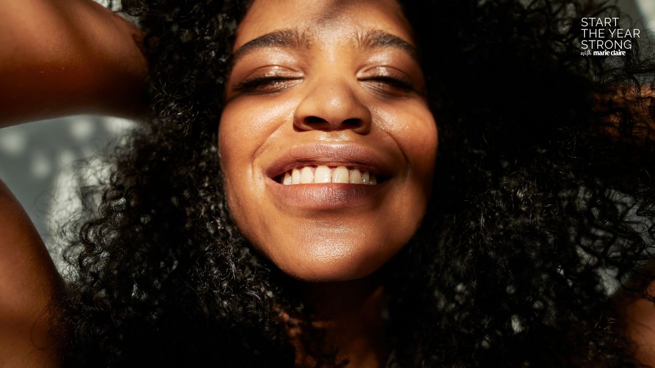 Mouth gut axis: A woman smiling showing her teeth