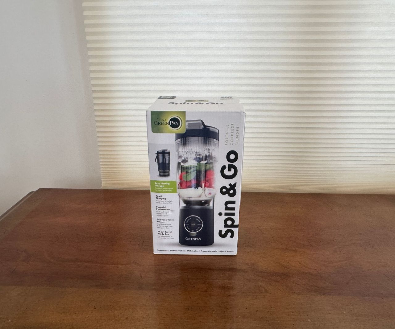 The white box for the the GreenPan Spin &amp; Go portable blender on a wooden table.