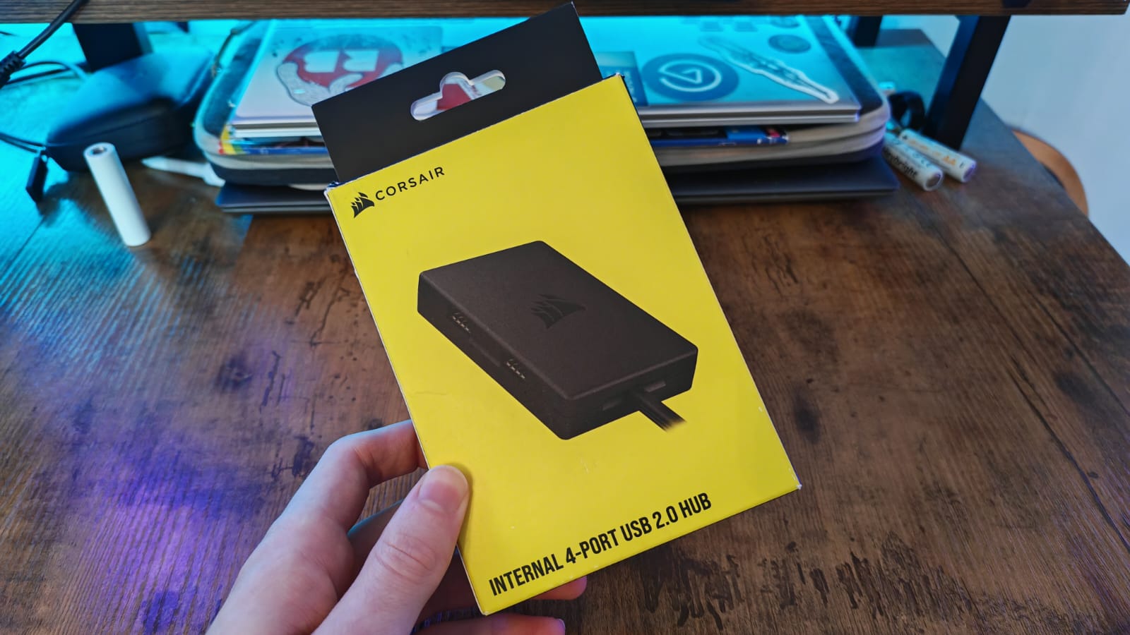 The box for the Corsair Internal 4-Port USB 2.0 Hub being held by a reviewer