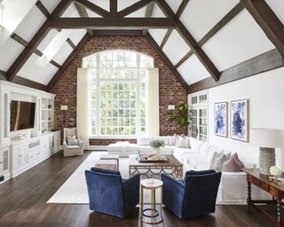 A living room with wooden beams as ceiling design