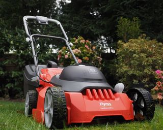 Flymo Easistore 340R Li Rotary lawn mower in use on grass