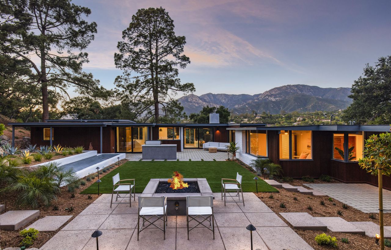 Exterior of a modern cabin bungalow at dusk 