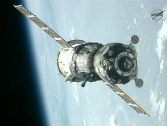 A Russian Soyuz TMA-05M spacecraft nears the International Space Station with the blue Earth in the background in this view from a station camera during a July 17, 2012 docking of the Expedition 32 crew.