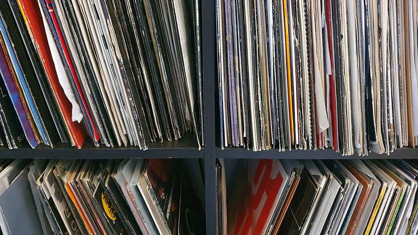 Shelves full of vinyl records.