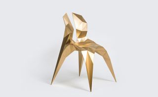 Abstract gold coloured chair