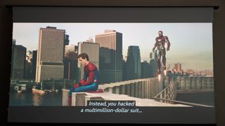 BenQ W5800 projector showing image from Spider-man movie