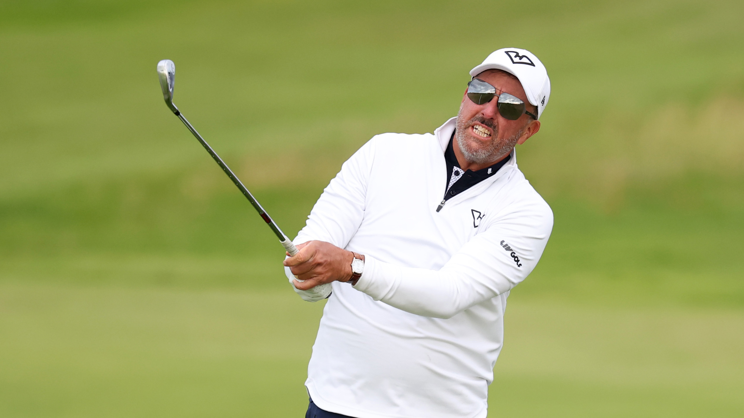 Phil Mickelson holds his finish on an iron shot