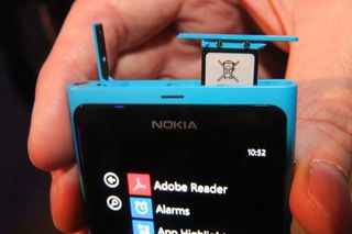 The Lumia 800's micro SIM slot is hidden beneath a flip up cover that's fiddly to pry open.