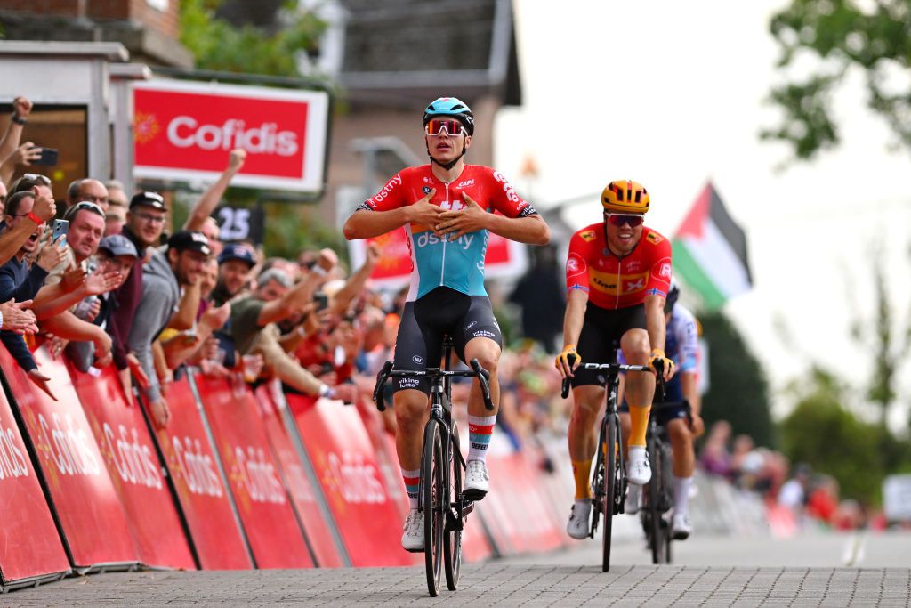 MONTDELENCLUS BELGIUM SEPTEMBER 28 Arnaud De Lie of Belgium and Team Lotto Dstny celebrates at finish line as race winner during the 82nd Circuit FrancoBelge 2023 a 1906km one day race from Tournai to MontdelEnclus on September 28 2023 in MontdelEnclus Belgium Photo by Luc ClaessenGetty Images