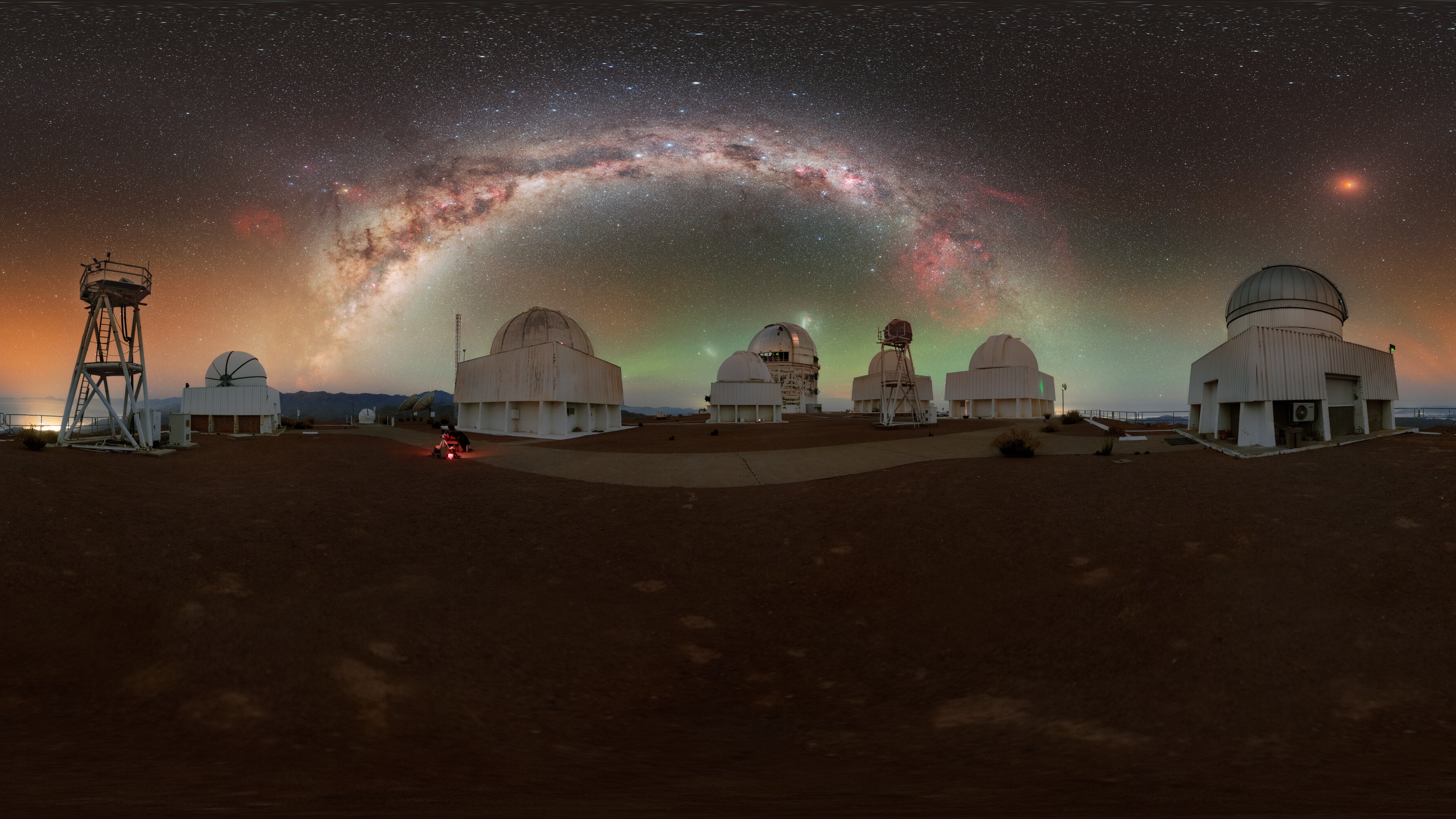 Dazzling photos of this month's total lunar eclipse showcase a blood red moon near the Milky Way's heart