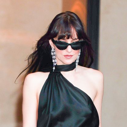 Dakota Johnson wears a black asymmetrical Gucci gown for The Materialists premiere