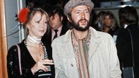Eric Clapton and his girlfriend fashion model Patti Boyd, ex-wife of ex-Beatle George Harrison, attend the premiere of the rock musical film 'Tommy' in London's Leicester Square, 26th March 1975. 