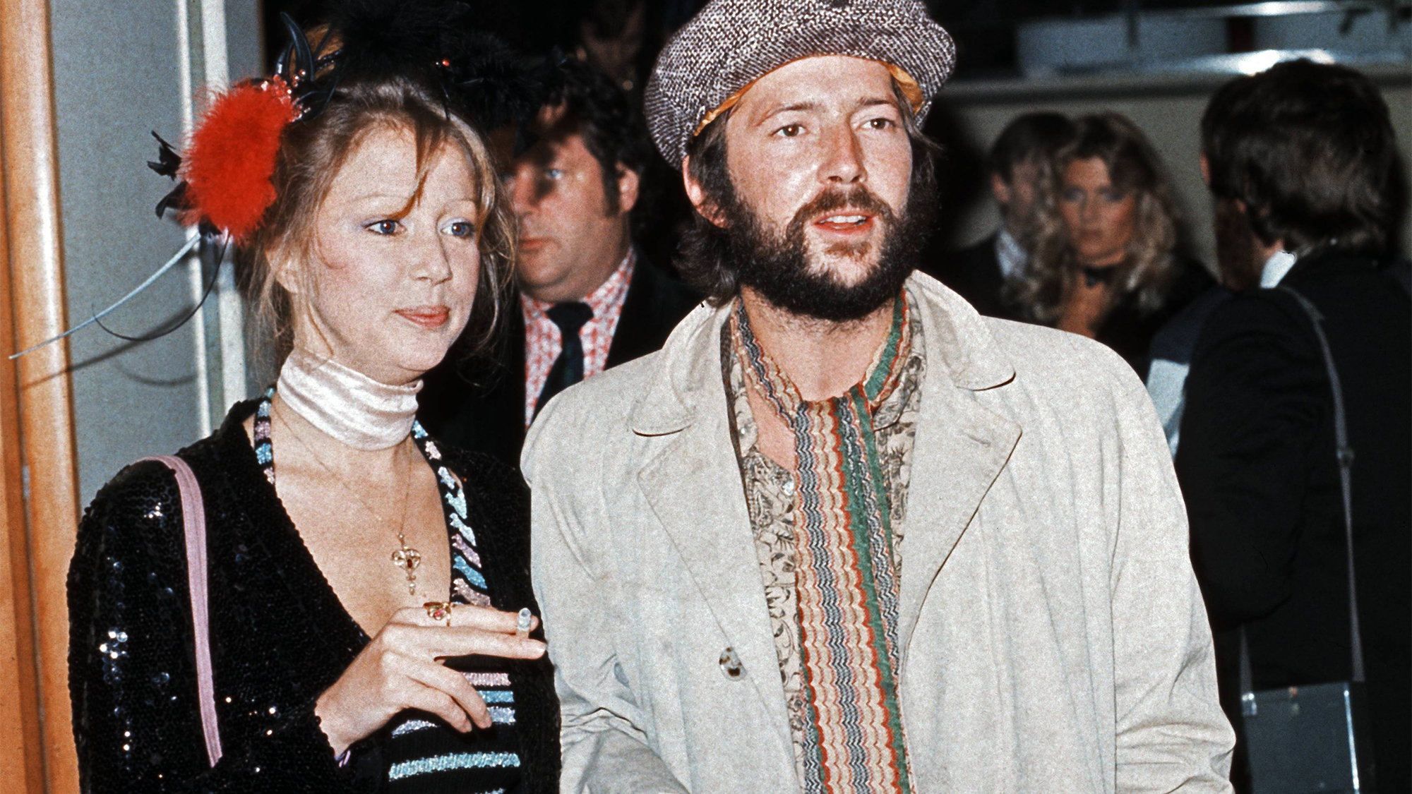 Eric Clapton and his girlfriend fashion model Patti Boyd, ex-wife of ex-Beatle George Harrison, attend the premiere of the rock musical film 'Tommy' in London's Leicester Square, 26th March 1975. 
