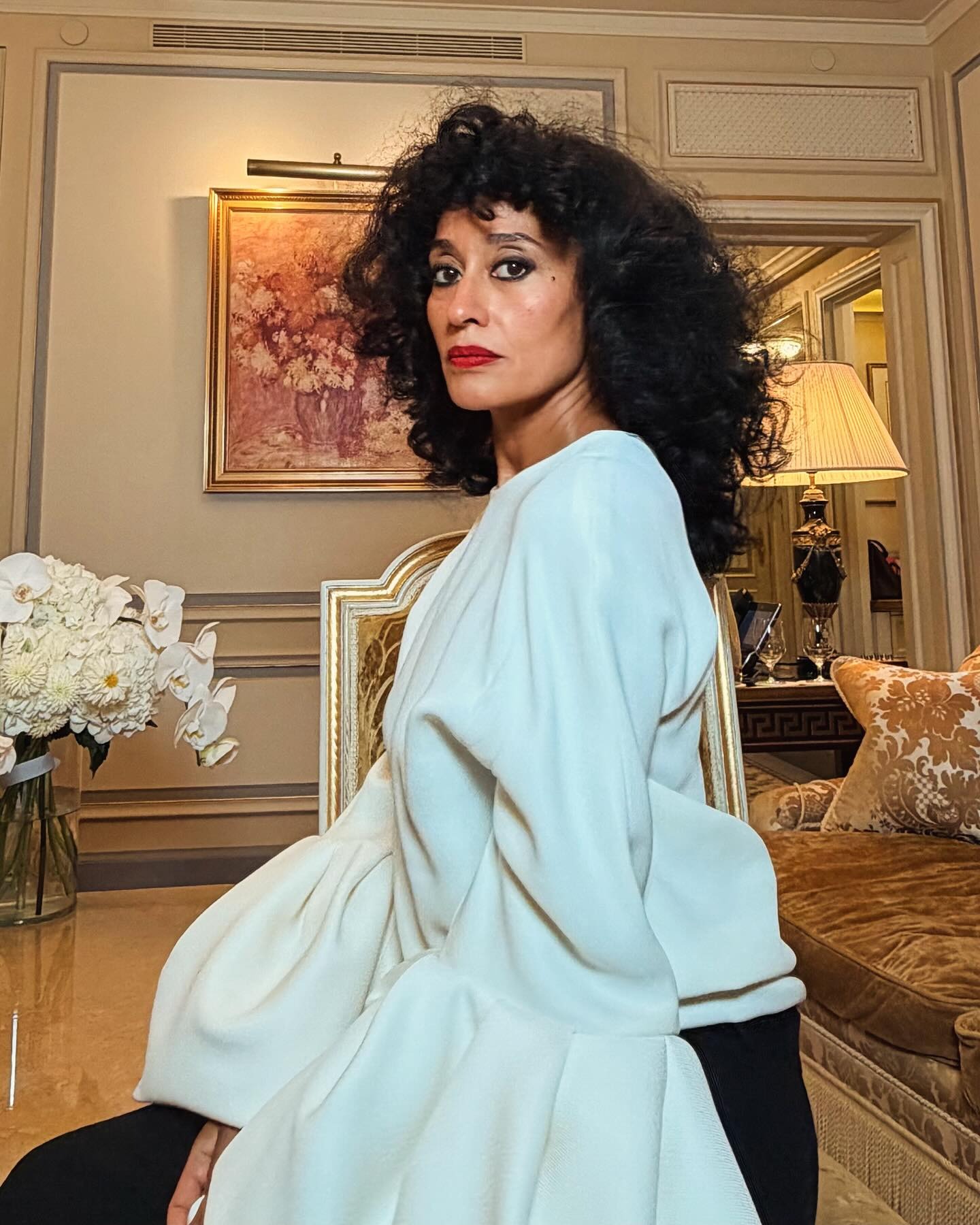 Tracee Ellis Ross with curly bangs.