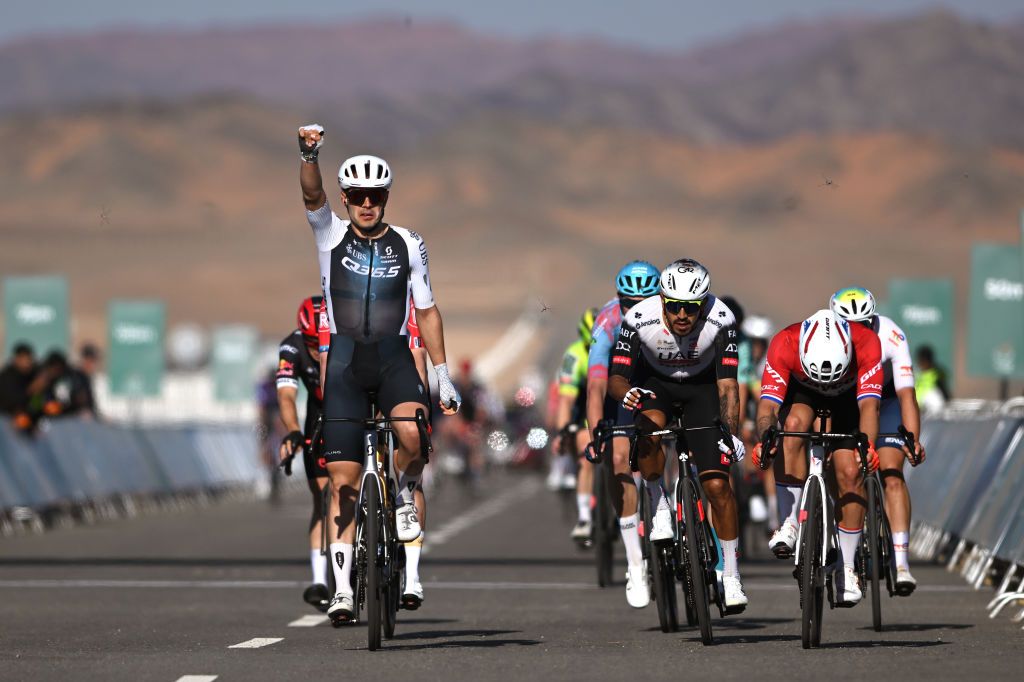 ALULA CAMEL CUP TRACK SAUDI ARABIA FEBRUARY 01 LR Matteo Moschetti of Italy and Q365 Pro Cycling Team celebrates at finish line as stage winner ahead of Juan Sebastian Molano of Colombia and UAE Team Emirates XRG and Dylan Groenewegen of The Netherlands and Team Jayco AlUla during the 5th AlUla Tour 2025 Stage 5 a 1696km stage from AlUla Camel Cup Track to AlUla Camel Cup Track on February 01 2025 in AlUla Saudi Arabia Photo by Szymon GruchalskiGetty Images