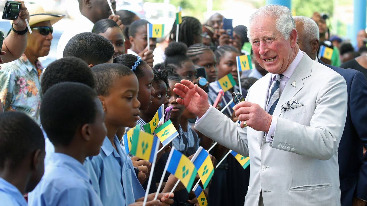 King Charles, as the Prince of Wales, greets schoolchildren welcoming him to St Vincent and the Grenadines on his Caribbean tour in 2019 