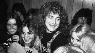 Robert Plant with The Runaways (Lita Ford, Joan Jett and Cheri Curry) in dressing room after their show at The Starwood Hollywood