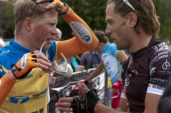 Tour leader Patrick Shaw (left) of Genesys Wealth Advisers discusses the race with stage seven winner Ben Kersten (Swan Hill Heart of the Murray).