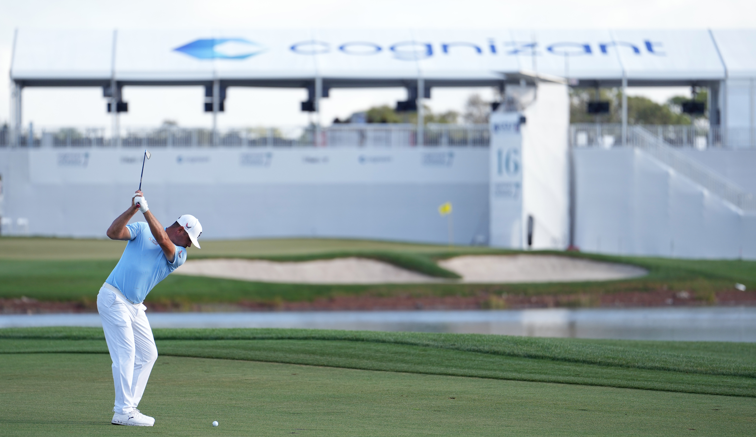 Gary Woodland hits an approach into the green
