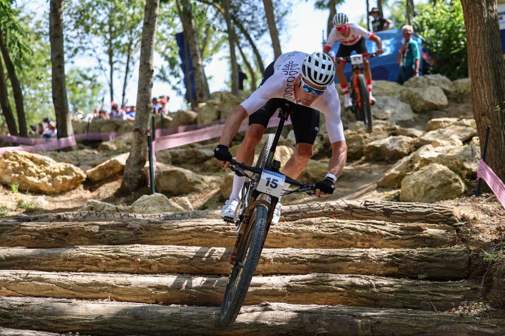 New Zealand&#039;s Samuel Gaze competes in the men&#039;s cross-country mountain biking event during the Paris 2024 Olympic Games in Elancourt Hill venue in Elancourt, on July 29, 2024. (Photo by Emmanuel DUNAND / AFP)