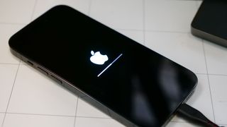 Apple logo on iPhone 14 Pro during restore from backup