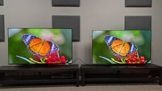 Samsung S95F (left) vs LG G5 (right) with orange butterfly on screen 