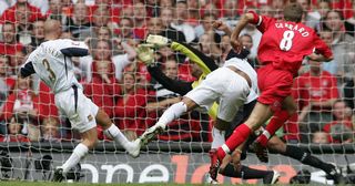 Liverpool's Steven Gerrard (R) puts the ball past West Ham goalkeeper Shaka Hislop to score his team's secong goal during the FA Cup final at the Millennium Stadium in Cardiff, 13 May 2006.