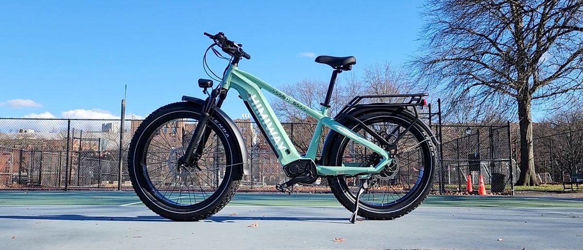 Himiway Zebra ebike near tennis courts in a park