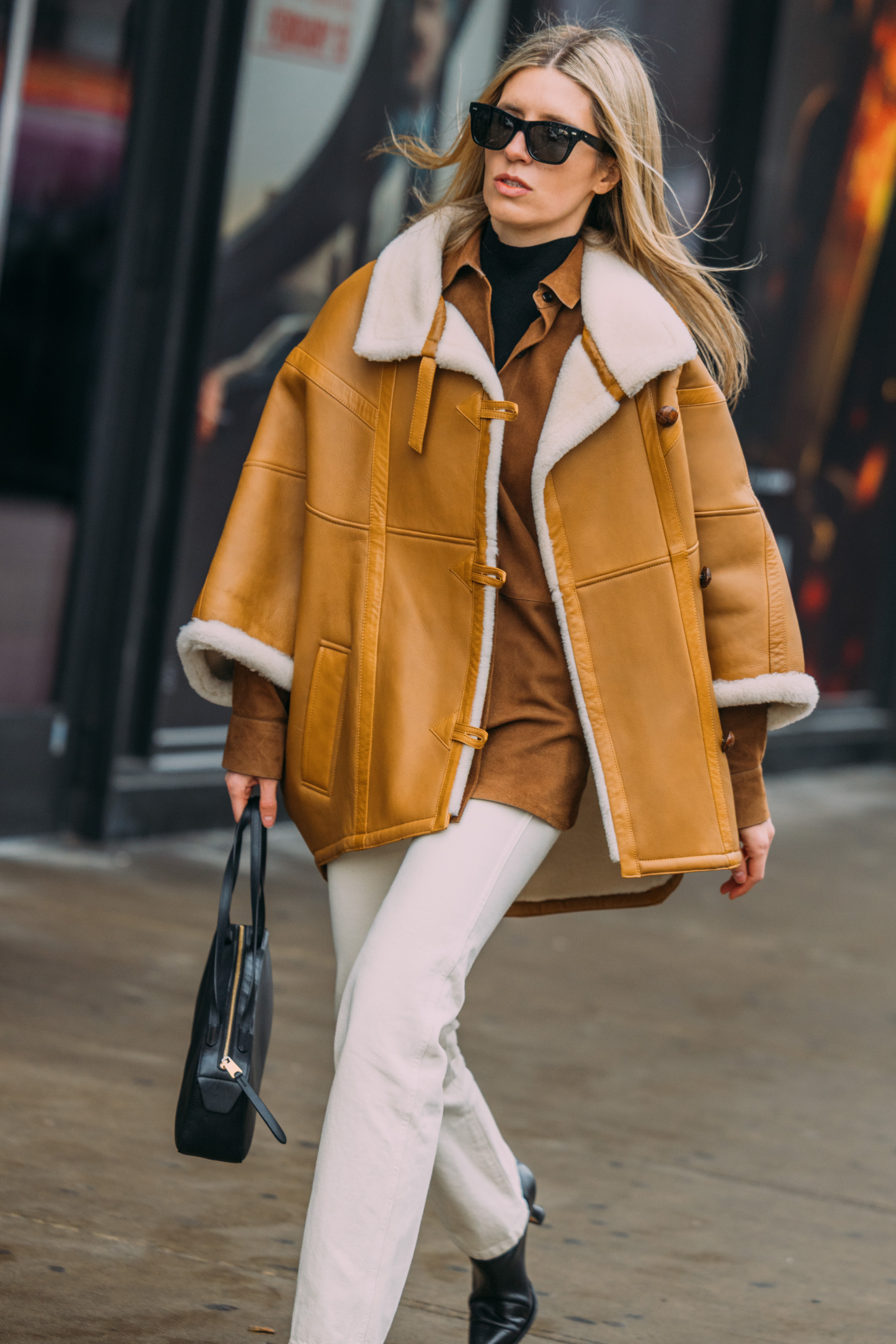 A woman wears straight jeans to fashion week.