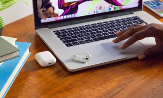 AirPods with MacBook. Credit: Shaun Lucas / Tom's Guide