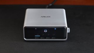 Anker Prime 250W desktop charger on a black leather mat