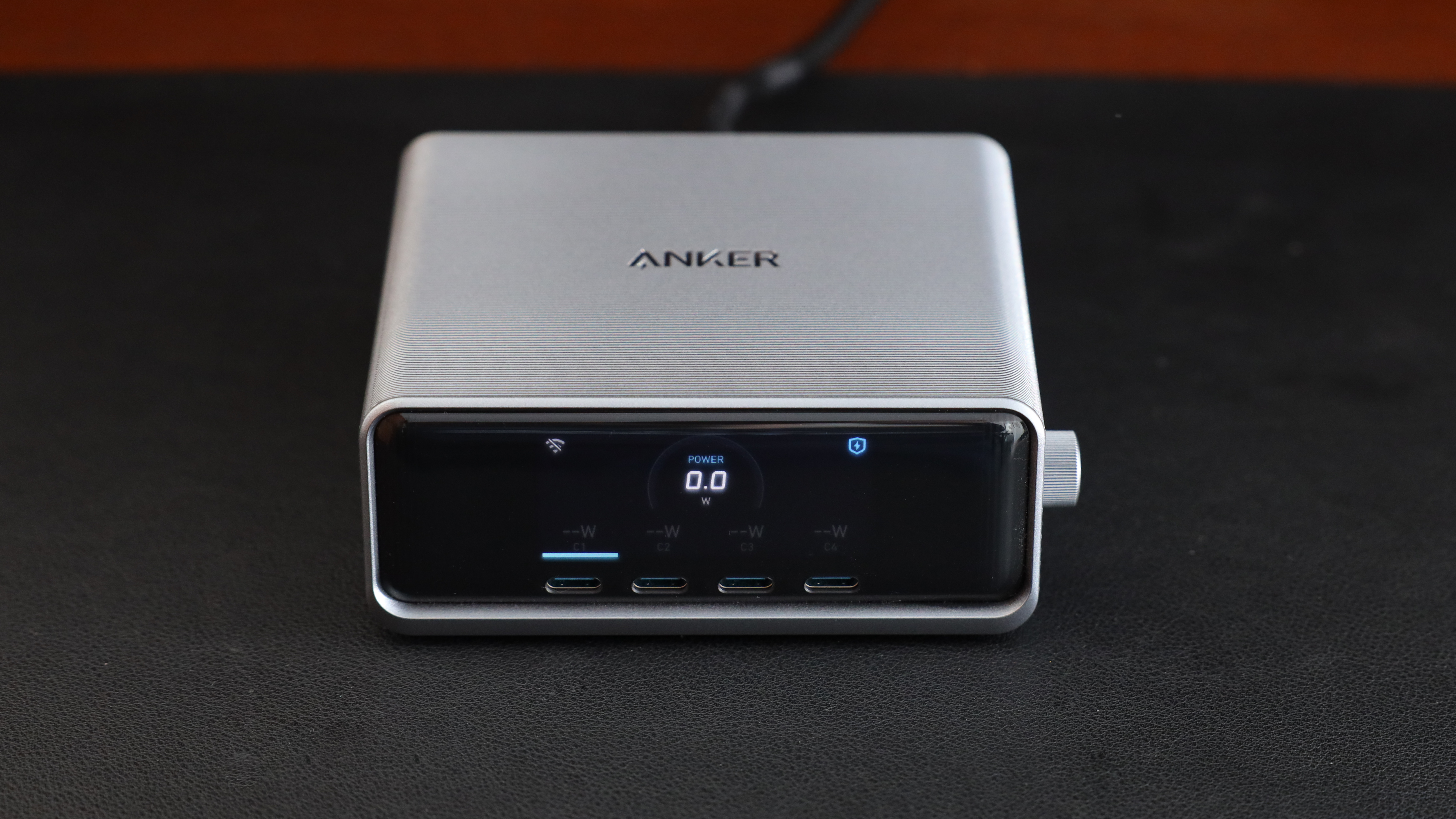 Anker Prime 250W Desktop Charger on a Black Leather Mat