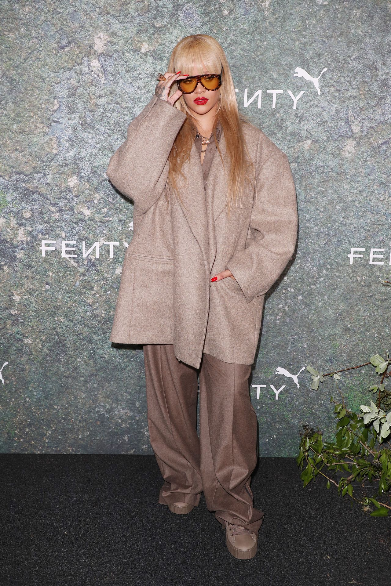 LONDON, ENGLAND - APRIL 17: Rihanna attends the FENTY x PUMA Creeper Phatty Earth Tone Launch Party at Tobacco Dock on April 17, 2024 in London, England. (Photo by Neil Mockford/WireImage)