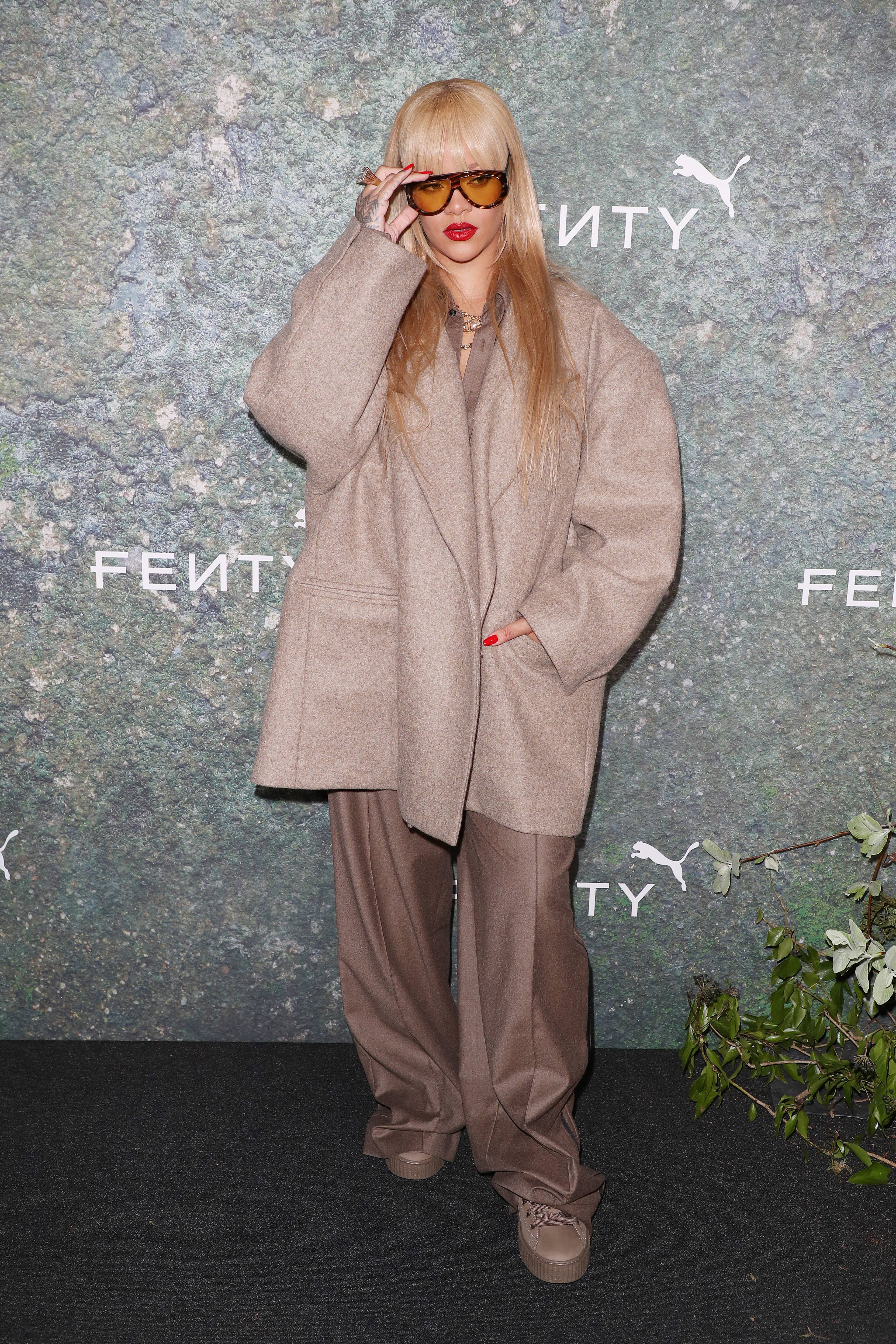 LONDON, ENGLAND - APRIL 17: Rihanna attends the FENTY x PUMA Creeper Phatty Earth Tone Launch Party at Tobacco Dock on April 17, 2024 in London, England. (Photo by Neil Mockford/WireImage)