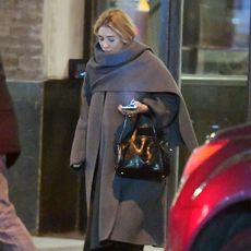 Ashley Olsen wearing a cape coat