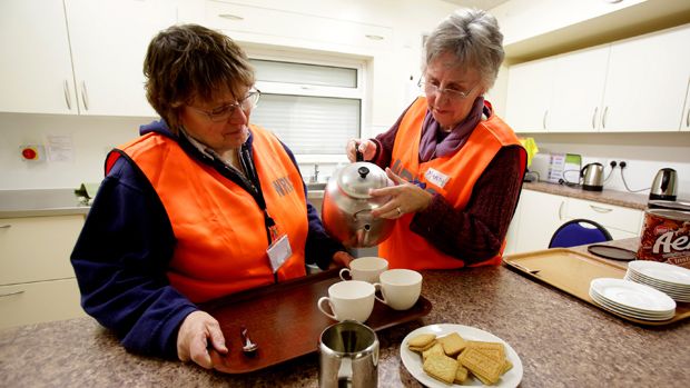 NORTH PETHERTON, UNITED KINGDOM - FEBRUARY 05:RVS volunteers Verity Trevor-Morgan and Marsha Casely make cups of tea at a rest centre that has been set up at North Petherton bowling club for 