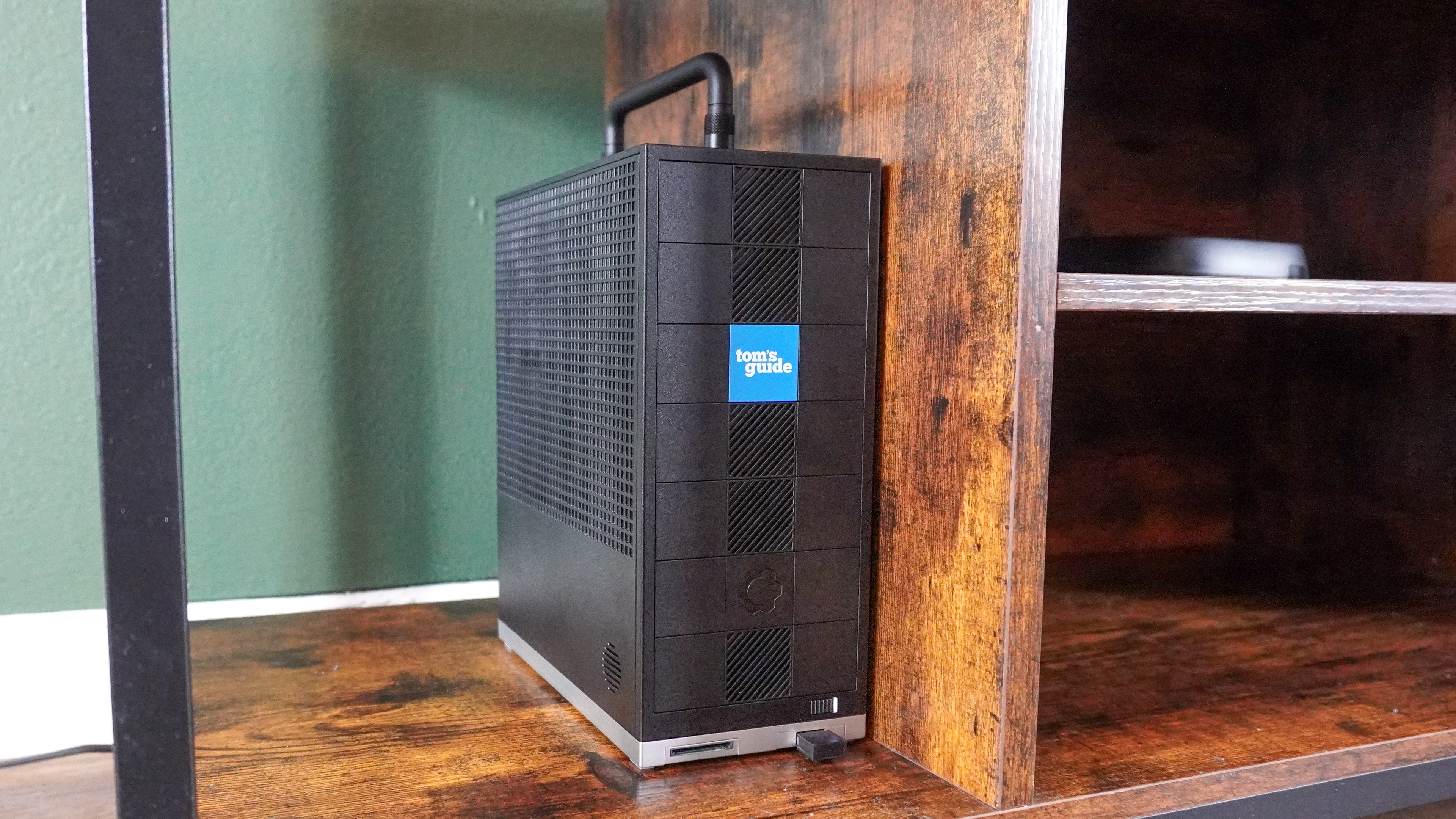 The Framework Desktop in an entertainment center in a living room