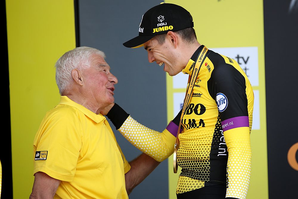 Wout Van Aert (Jumbo-Visma) speaks with Raymond Poulidor on the podium at the Tour de France