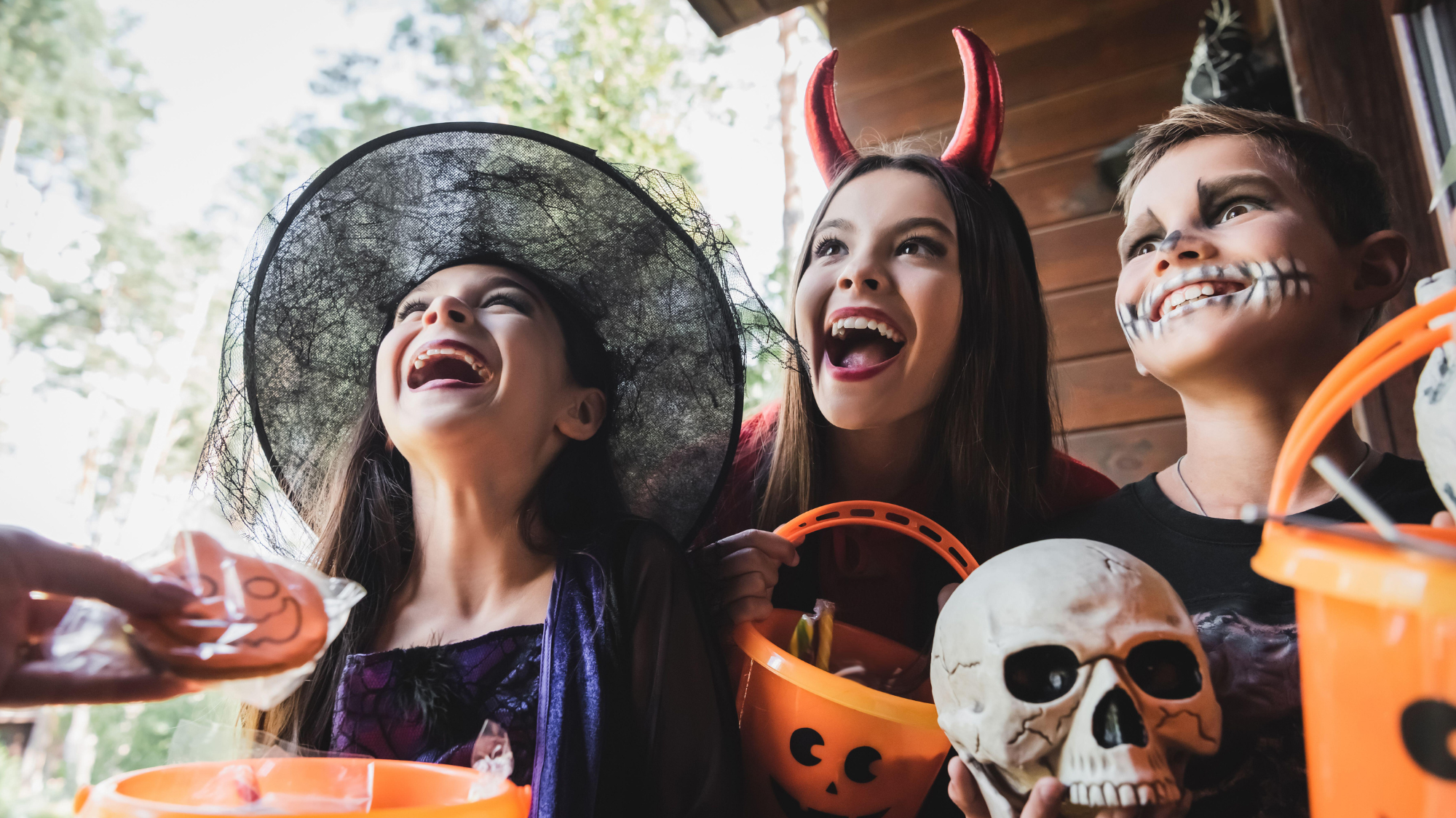 Kids in Halloween costumes trick or treating