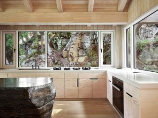 douglas fir kitchen with an island made from dark granite