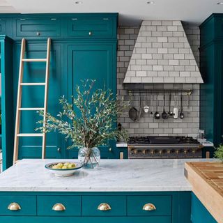 kitchen with marble worktop fruit bowl and wooden ladder