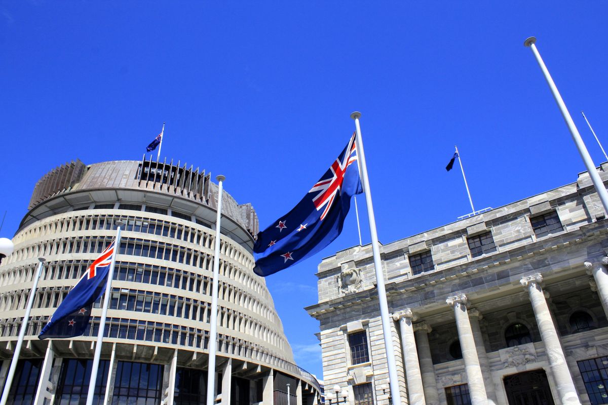 The New Zealand flag flying outside of Parliament