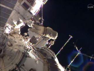 cosmonaut working in spacesuit