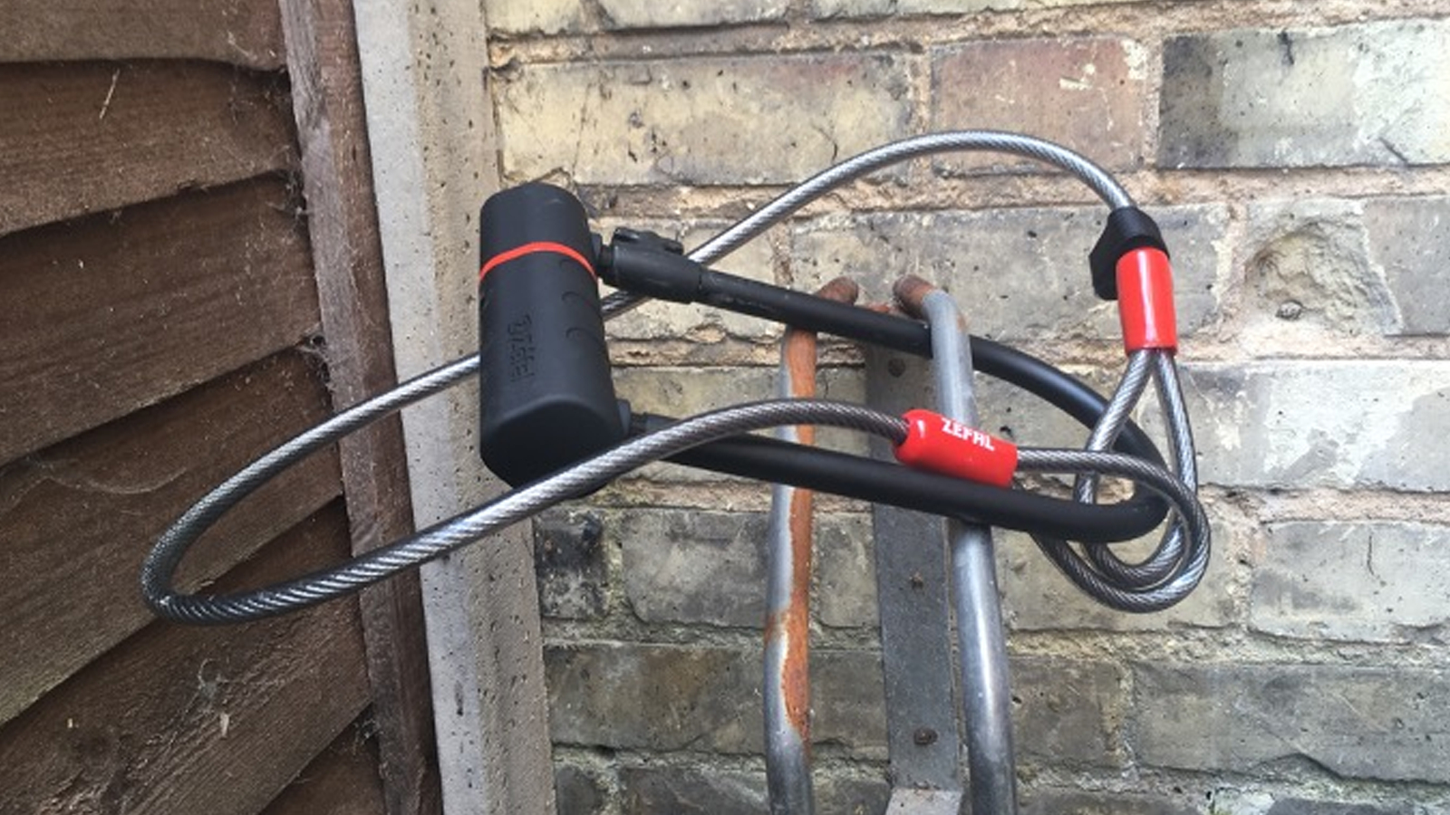 A Zefal K-Traz U17 lock with cable attached to a bike rack