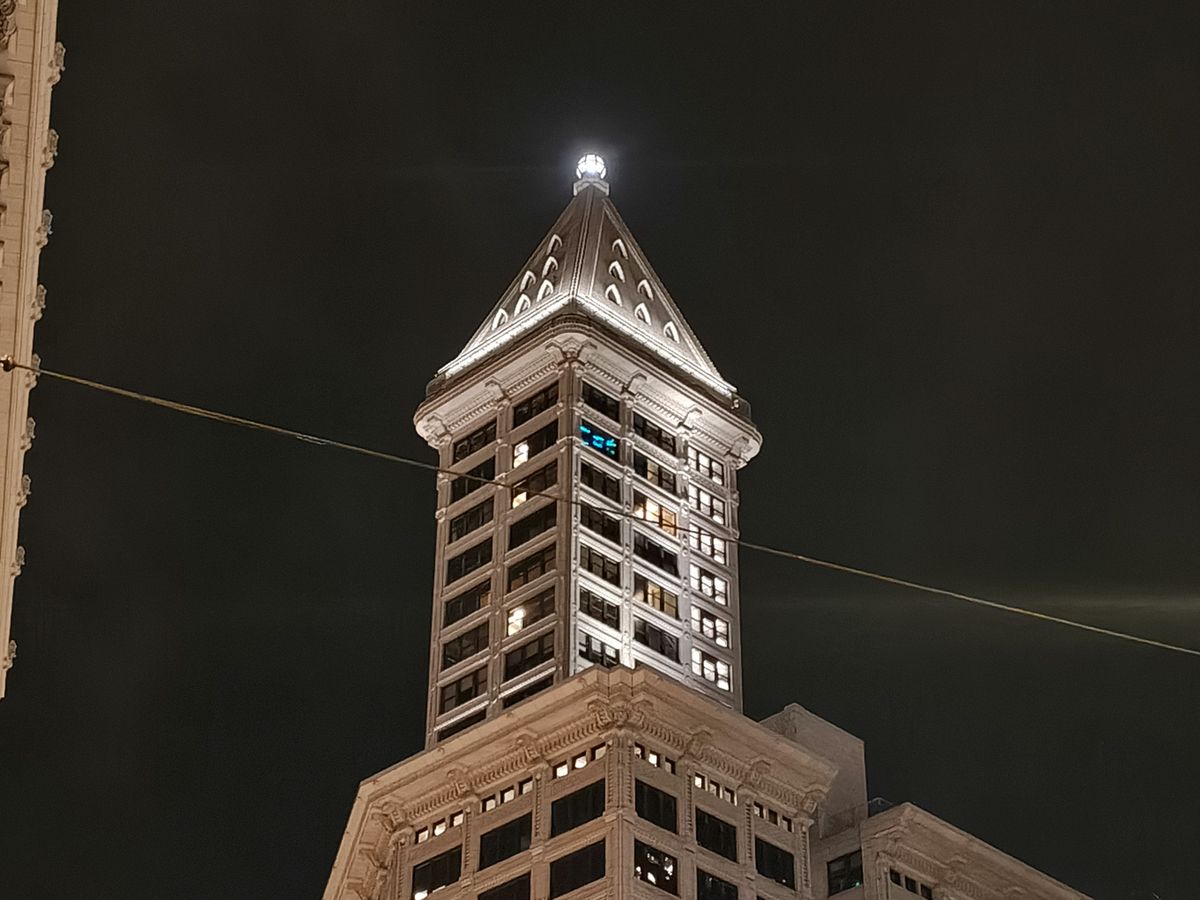 A tower lit up at night