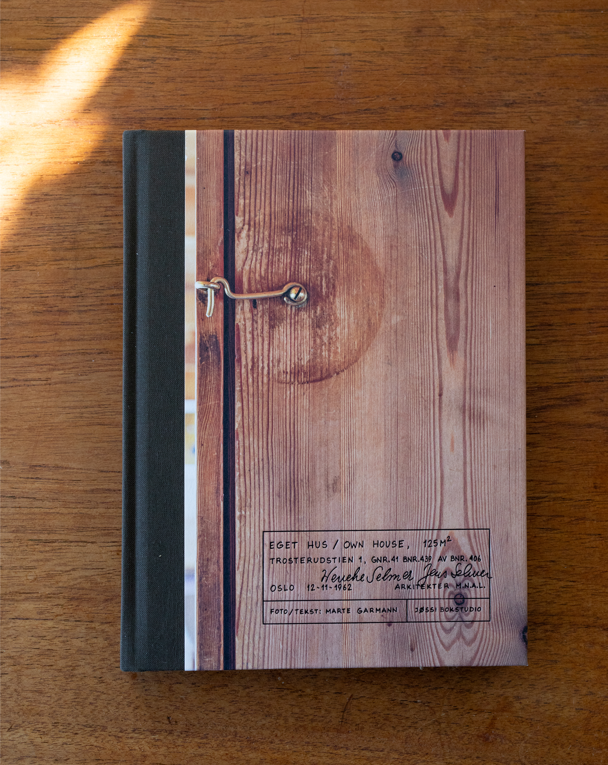 photo of the book 'Own House', showing the cover, on the personal home/cabin of architect Wenche Selmer