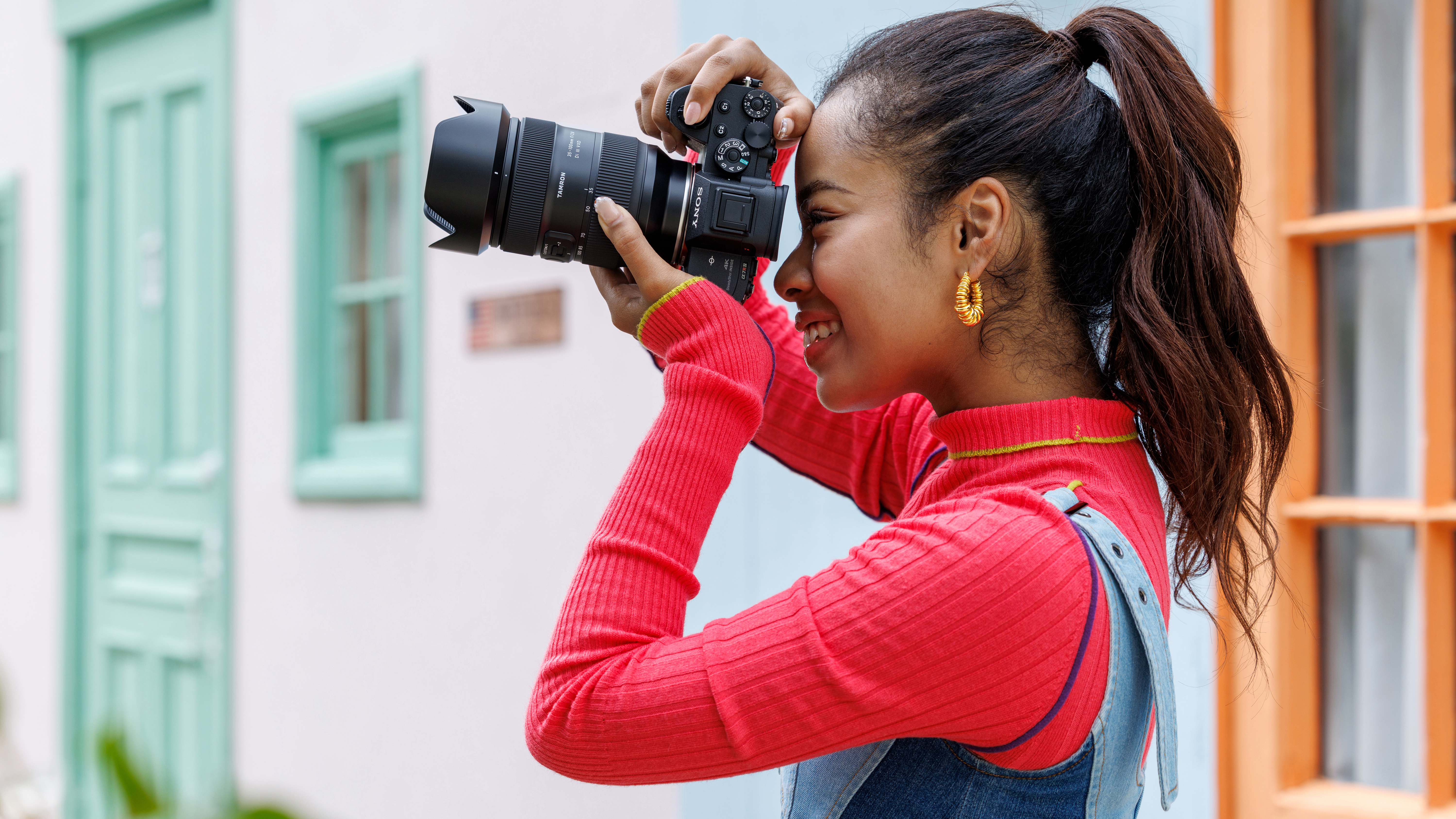 A photographer using the Tamron 35-100mm f/2.8 Di VXD III