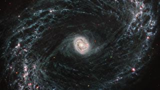 An image of a Barred spiral galaxy with a double ring structure.