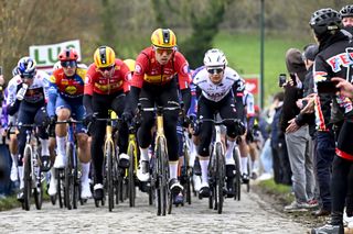 The pack of riders pictured in action during the men's one-day cycling race Omloop Het Nieuwsblad (UCI World Tour), 197 km from Gent to Ninove, Saturday 01 March 2025. BELGA PHOTO JASPER JACOBS (Photo by JASPER JACOBS / BELGA MAG / Belga via AFP) (Photo by JASPER JACOBS/BELGA MAG/AFP via Getty Images)